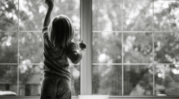 picture of child cleaning windows