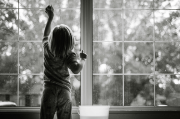 picture of child cleaning windows